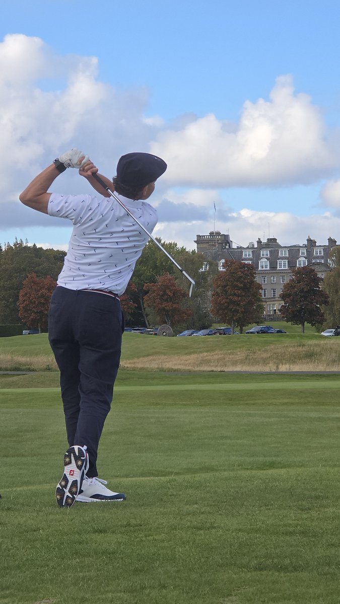 Golfer playing the Gleneagles Wee Course with the hotel in the background